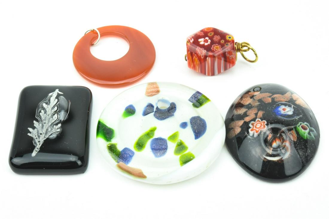 Collection Of Art Glass Necklace Pendants: Collection Of Art Glass Necklace Pendants. Four Italian Venetian Murano art glass necklace pendants and one carnelian necklace pendant. Largest measures 1.75 inches in diameter.