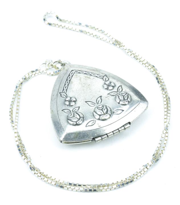 Locket Pendant On Italian Sterling Chain: Locket Pendant On Italian Sterling Chain. Chain is hallmarked "925" and "Italy". Locket features a floral motif on front. Chain measures 18 inches in length.