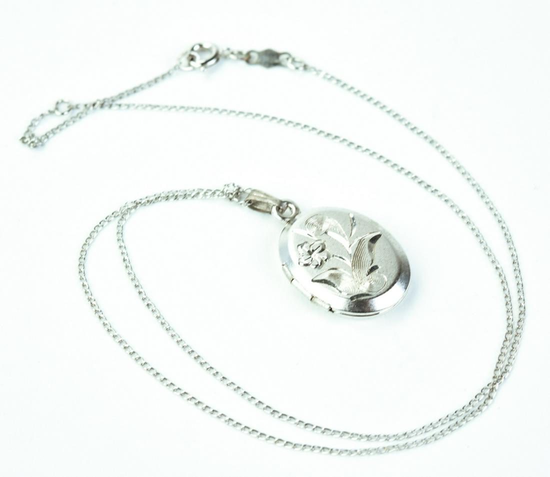 Sterling Silver Locket Necklace Pendant on Chain: Sterling Silver Locket Necklace Pendant on Chain. Chain is hallmarked and measures 16.5 inches in length.
