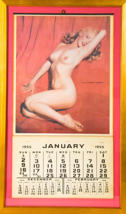Marilyn Monroe Advertising Nude Calendar 1955: Marilyn Monroe Advertising Nude Calendar, 1955. Depicting the famous 'Golden Dreams' image, text printed on right side reads "Posed by Marilyn Monroe". Gold leaf frame. Measures 25 inches high by 15 i