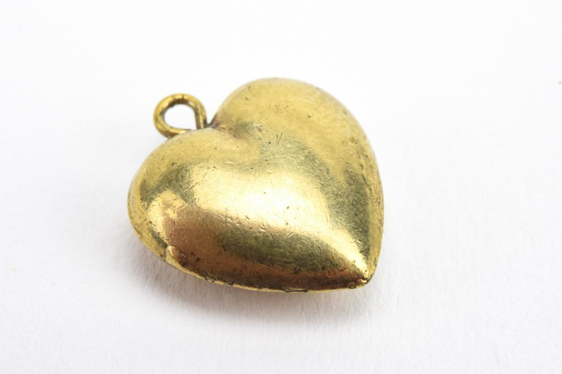 Antique 19th C Gold Puffy Heart Necklace Pendant: Antique 19th C Gold Puffy Heart Necklace Pendant. Acid tests as 10kt, may be gold filled. Measures 5/8ths of an inch in length.