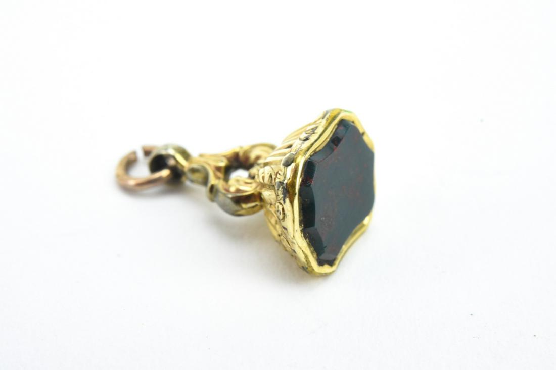 Antique 19th C Georgian Gold & Bloodstone Fob: Antique 19th C Georgian Gold & Bloodstone Fob. Set with a carved bloodstone panel. Acid tests as 14kt gold, may be cased. Measures .75 of an inch in length.