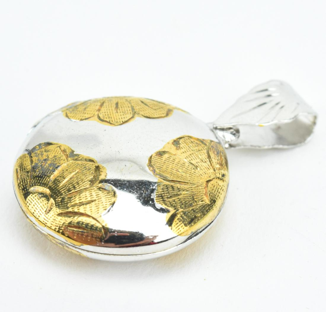 Vintage Sterling & Vermeil Locket Necklace Pendant: Vintage Sterling & Vermeil Locket Necklace Pendant. Floral motif. Measures just over 1.25 inches in length.