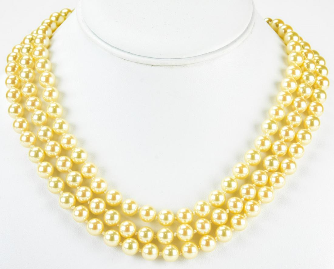 Circa 1990 Triple Strand Pearl Choker Necklace: Circa 1990 Triple Strand Pearl Choker Necklace. Three strands of faux pearls. Measures approximately 15 inches.