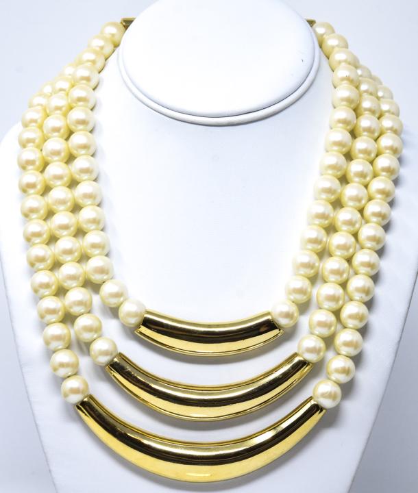 Vintage Alexis Kirk Gilt Metal Faux Pearl Necklace: Vintage Alexis Kirk Gilt Metal Faux Pearl Necklace. Signed. Three tiers. Measures 18.25 inches in length.