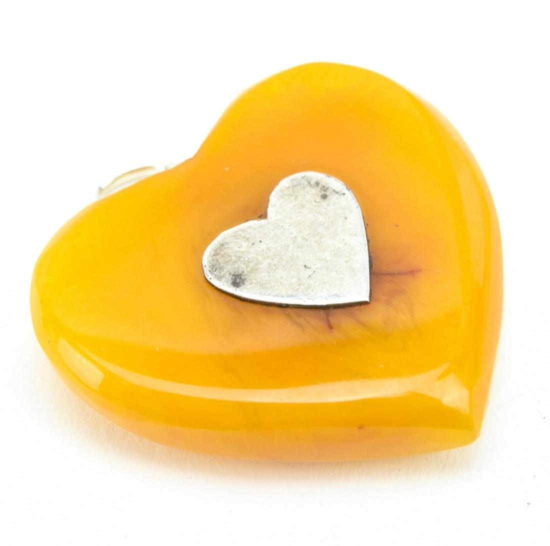 Estate Butterscotch Amber Bakelite Sterling Heart: Estate Butterscotch Amber Bakelite Sterling Heart Necklace Pendant. Measures 1.5 inches in length.