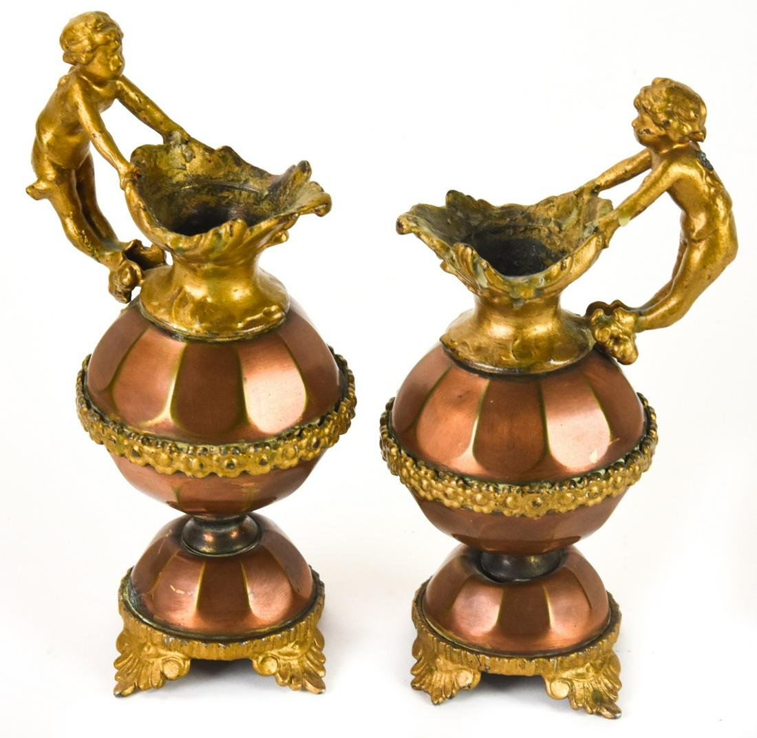 Pair of Antique Ormolu Decorative Ewers w Cherubs: Pair of Antique Ormolu Decorative Ewers w Cherubs. Each measures 8 inches in height.