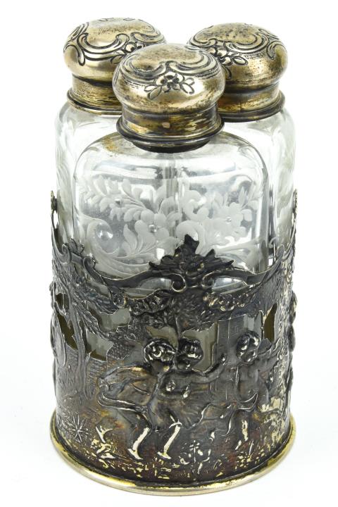 3 Antique Etched Glass & Sterling Silver Flasks: 3 Antique Etched Glass & Sterling Silver Flasks 3 Antique Etched Glass & Sterling Silver Flasks. Flasks fit together in a repousse sterling silver base. Base features young