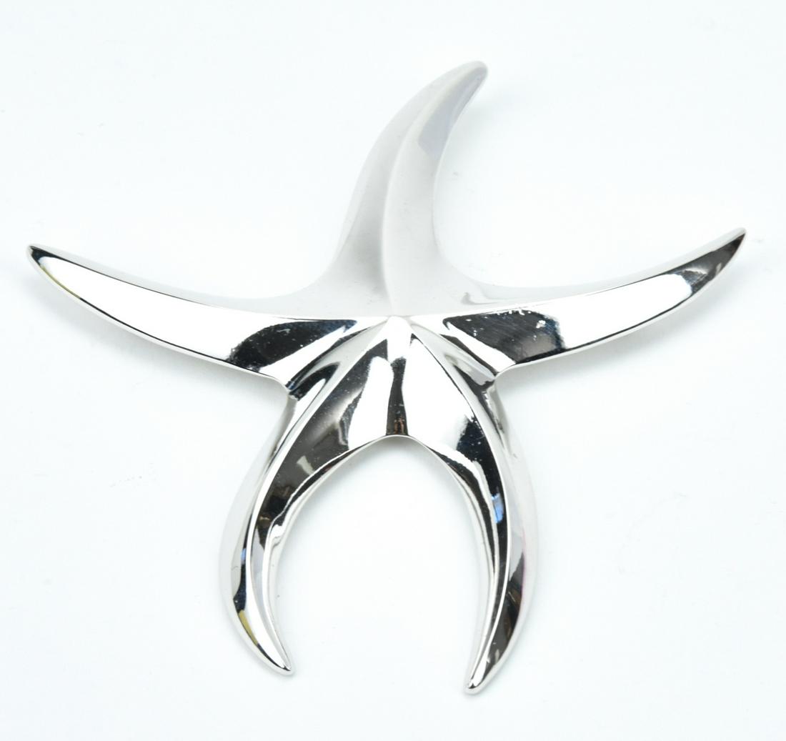 Huge Vintage Silver Tone Monet Starburst Brooch: Huge Vintage Silver Tone Monet Starburst Brooch. Costume jewelry pin. Signed. Measures 4.25 inches in length.