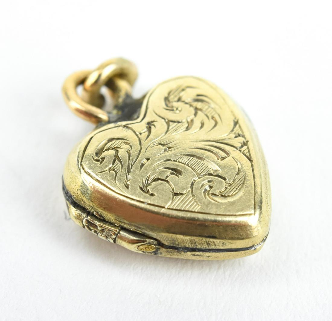 Antique 19th C English 9kt Gold Heart Locket: Antique 19th C English 9kt Gold Heart Locket Necklace Pendant. Measures 5/8ths of an inch in length.