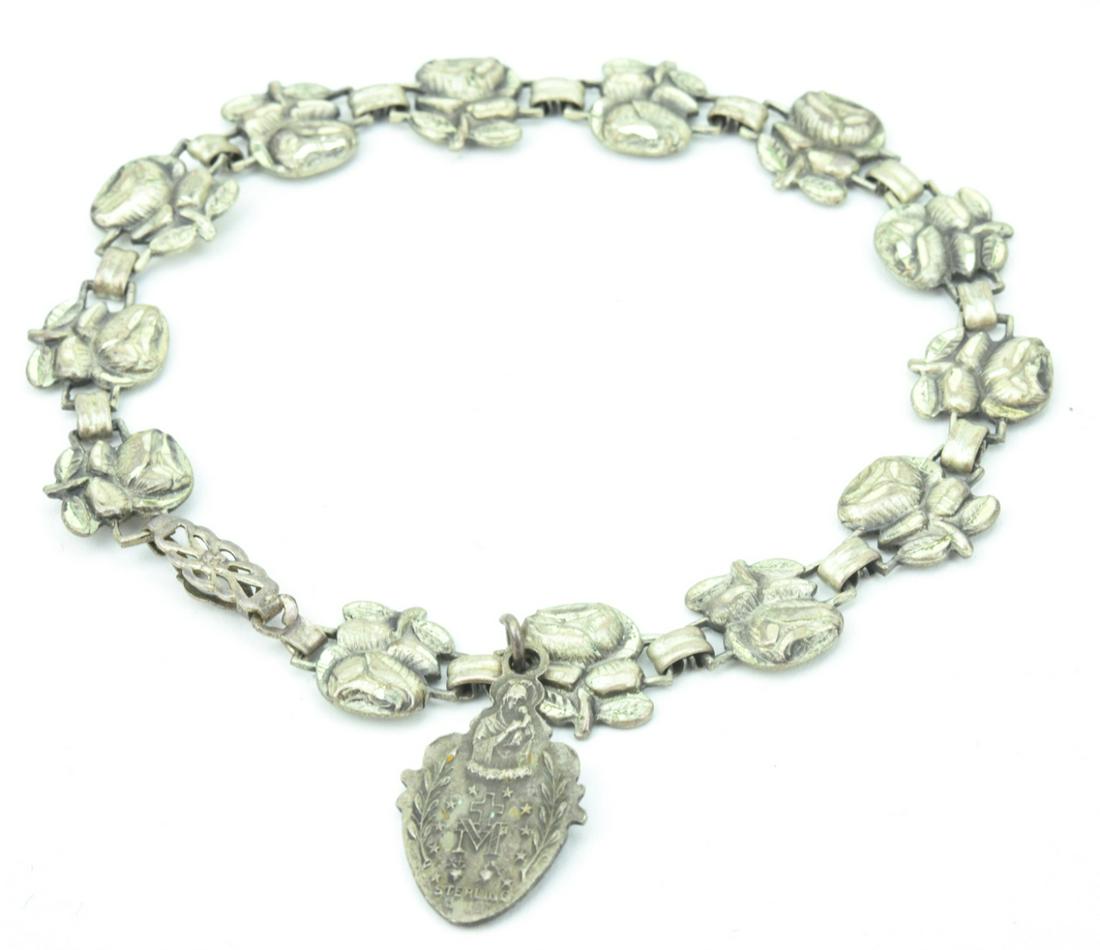 Sterling Silver Rosary Bead Bracelet: Sterling Silver Rosary Bead Bracelet. Measures 8 inches in length.