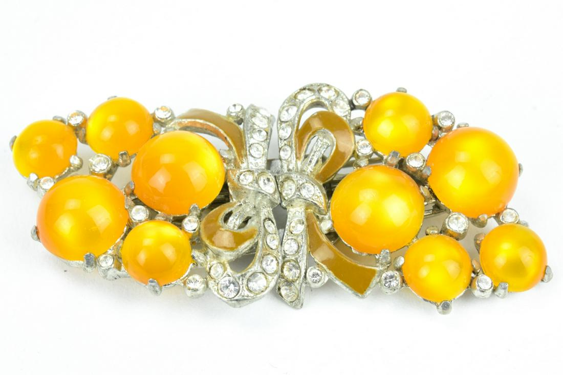 Vintage Costume Jewelry Coro Duette: Vintage Costume Jewelry Coro Duette. Set with cabochons, clear rhinestones, and enamel. Measures just under 3 inches in length.