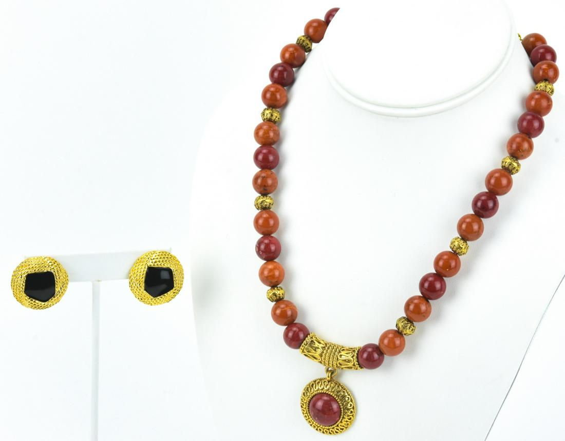 Collection of Vintage Costume Jewelry: Collection of Vintage Costume Jewelry. Faux amber necklace by Napier together with clip on earrings by Monet. Necklace measures 19 inches in length.