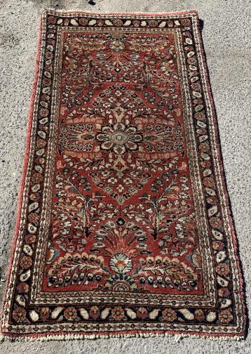Hand Knotted Persian Wool Area Rug: Hand Knotted Persian Wool Area Rug. Features 3 floral medallions in red, blue, and ivory tones. Made in Iran. Measures 49 inches long x 25 inches wide.