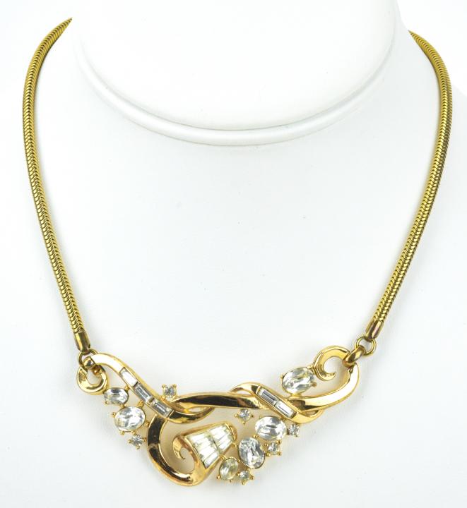 Trifari Gilt Metal & Rhinestone Necklace: Trifari Gilt Metal & Rhinestone Necklace. Measures 16 inches in length.