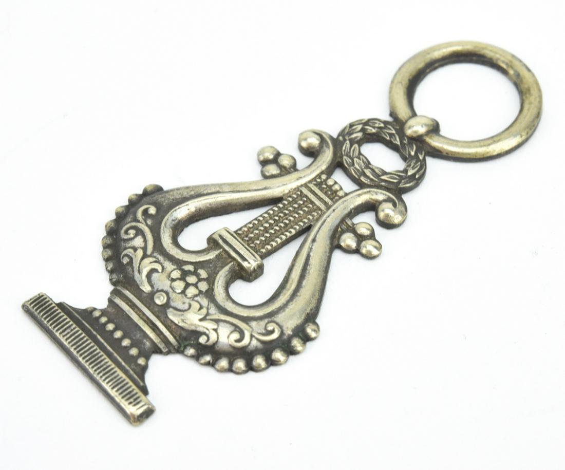 Antique 19th C Silver Lyre Form Necklace Pendant: Antique 19th C Silver Lyre Form Necklace Pendant w Acanthus Leaf Wreath. Measures just over 1.75 inches in length. Tests as 800 / coin silver.