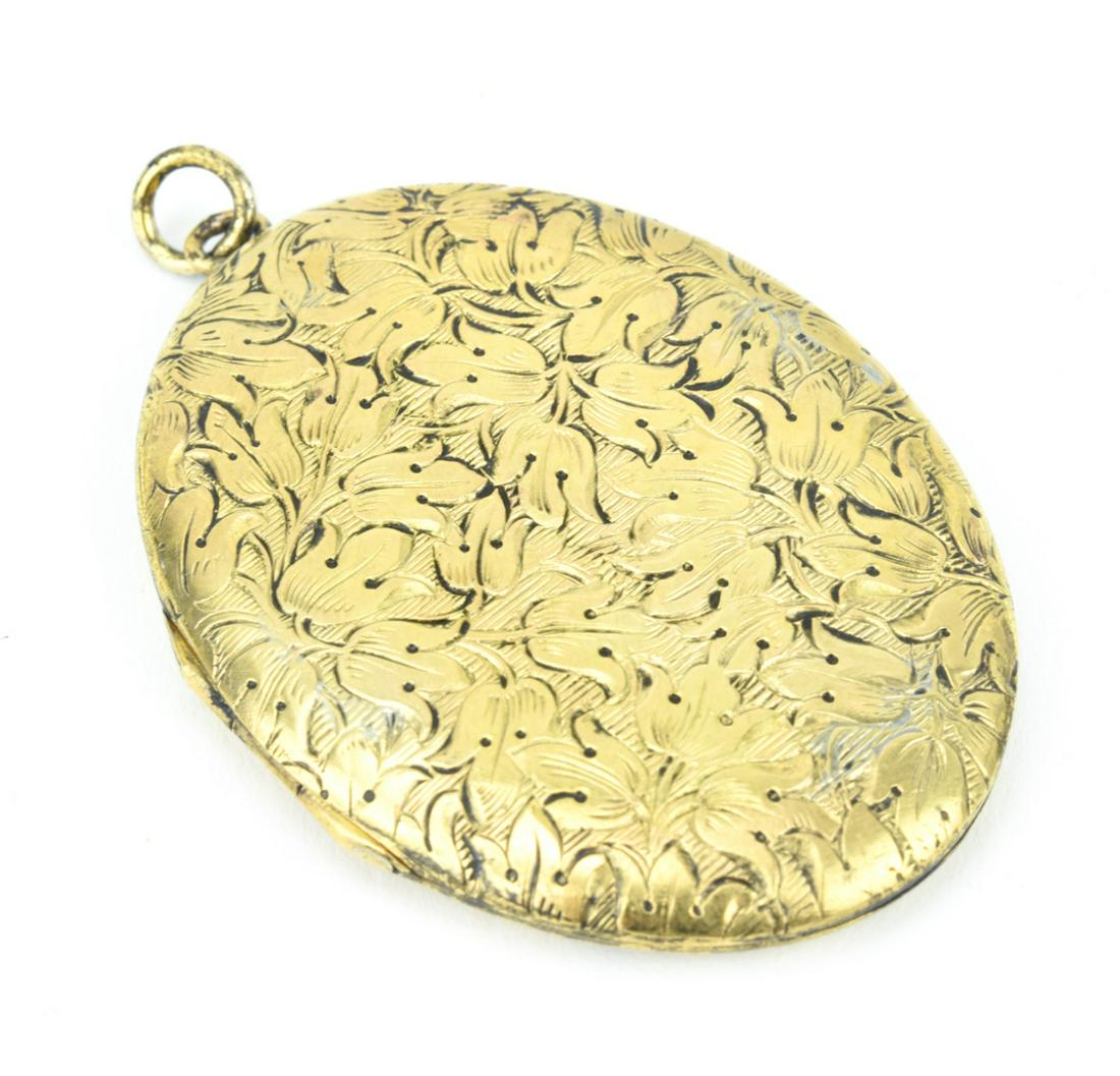 Antique Gold Filled Floral Motif Locket: Antique Gold Filled Floral Motif Locket. Measures 2.5 inches in length.