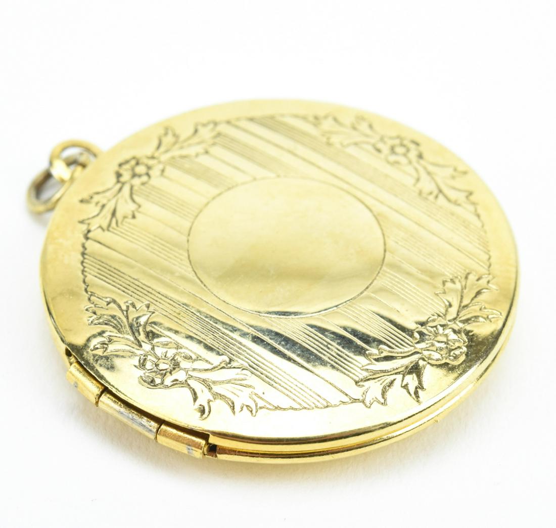 Estate Gold Filled Art Deco Motif Locket Pendant: Estate Gold Filled Art Deco Motif Locket Pendant. Circular locket necklace pendant. Measures 1.5 inches in length.