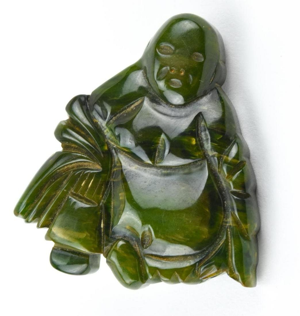 Vintage Carved Marbled Bakelite Buddha Brooch: Vintage Carved Marbled Jade Tone Bakelite Chinoiserie Buddha Brooch. Measures 2 inches in length.