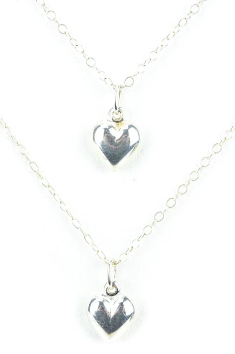 Two Sterling Silver Necklaces w Puffy Heart Charms: Two Sterling Silver Necklaces w Puffy Heart Charms / Pendants. The chains are approximately 14.5 and 16.5 inches.