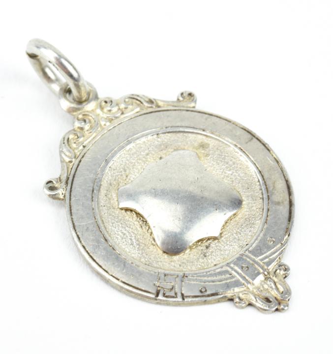 Antique English Sterling Coat of Arms Pendant: Antique English Sterling Silver Coat of Arms Shield Design w Belt Buckle Halo Necklace Pendant / Fob / Medal. Hallmarked. Measures just under 1.75 inches in length.