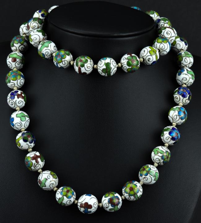 Antique Chinese Sterling Cloisonne Enamel Necklace: Antique Chinese Sterling Cloisonne Enamel Necklace. Necklace is hand knotted. Beads are approximately 3/8ths of an inch in diameter. Measures 28 inches in length.