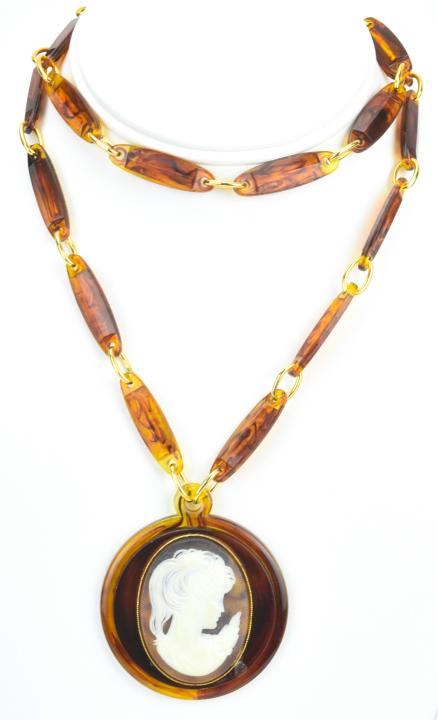 Vintage W. Germany Faux Tortoise Cameo Necklace: Vintage Western Germany Faux Tortoise Cameo Necklace. Original tag. Measures 29 inches in length, plus pendant which is 2.25 inches in length.