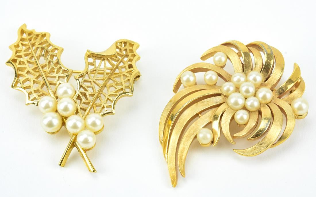 2 Vintage Trifari Gilt Metal & Faux Pearl Brooches: 2 Vintage Trifari Gilt Metal & Faux Pearl Brooches. Each set with faux pearls. Larger measures 2.5 inches in length.
