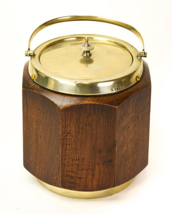 1923 English Wood & Porcelain Tea Caddy: 1923 English Wood Shell & Porcelain Interior Tea Caddy. With silver metal lid, handle & shield medallion. Measures 6.5 inches high x 6 inches in diameter.