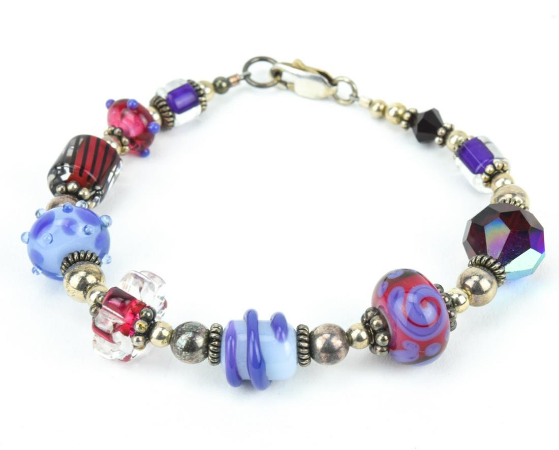 Sterling Silver & Murano Art Glass Bead Bracelet: Sterling Silver & Murano Art Glass Bead Bracelet. Hallmarked clasp. Measures 7.75 inches in length.