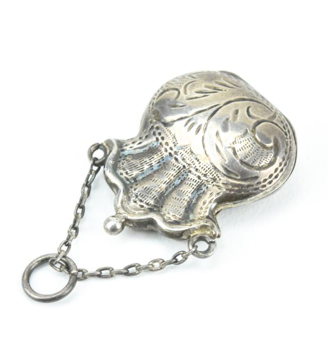 Antique Sterling Silver Purse Form Locket Pendant: Antique Sterling Silver Purse Form Locket Pendant. Chased sterling silver. Measures just over 1.5 inches in length.