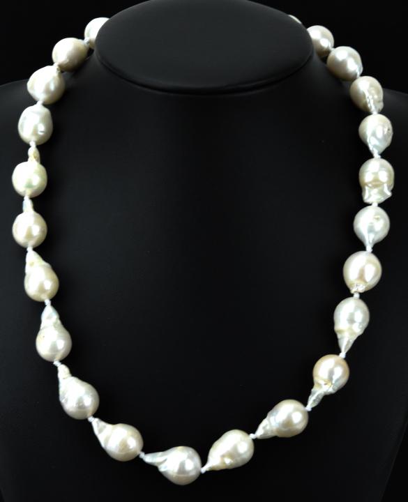Hand Knotted Silk Cultured Baroque Pearl Necklace: Hand Knotted Silk Cultured Baroque Pearl Necklace Strand. Featuring high luster cultured baroque pearls from the Ha Long Bay area of Vietnam with iridescent tones of white, pink, champagne and cream. 