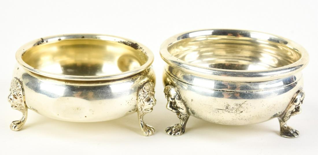 Pair Sterling Silver Lion Motif Salt Cellars: Pair Sterling Silver Lion Motif Salt Cellars. Hallmarked. Each approximately 3 inches in width. Estate inventory #128.