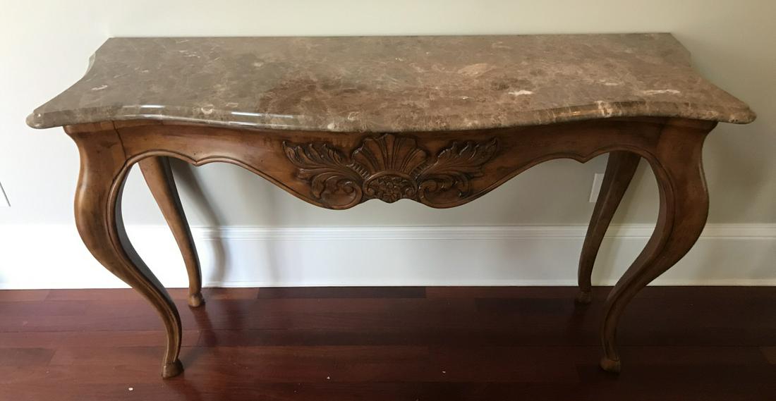 Hand Carved French Country Style Marble Console: Hand Carved French Country Style Marble Console. Hand carved base with serpentine form marble top. Measures 36 x 64 x 21 inches.