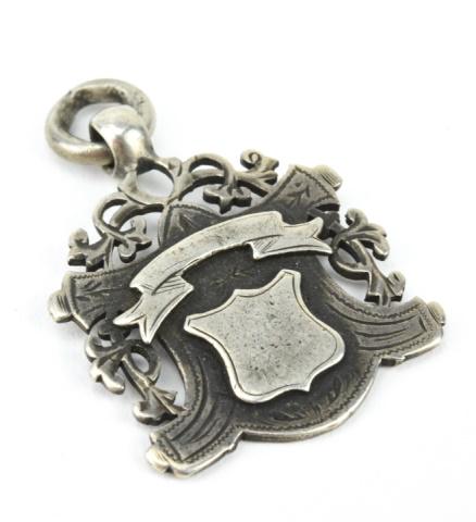 Antique English Sterling Silver Shield Pendant: Antique English Sterling Silver Coat of Arms Shield Form Necklace Pendant / Fob / Medal. Hallmarked. Measures just over 1.5 inches in length.