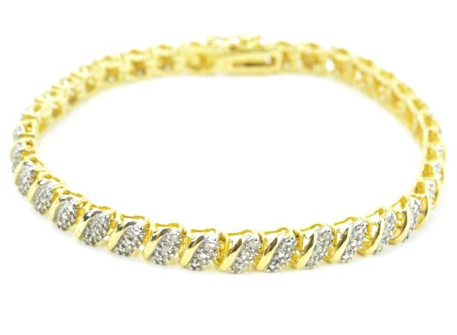 Diamond Set Gold Over Sterling Tennis Bracelet: Diamond Set Gold Over Sterling Tennis Bracelet. Articulated panel bracelet having seventeen links that are set with diamonds. Hallmarked. Measures nearly 7.5 inches in length.