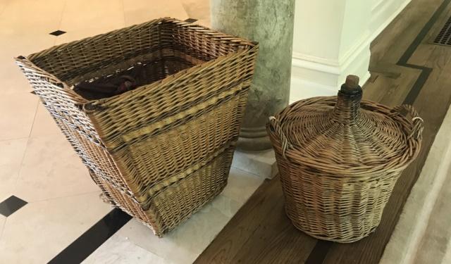 Two Antique Wine Related Woven Wicker Baskets: Two Antique Wine Related Woven Wicker Baskets. Larger measures 18.5 x 18 x 16.5 inches. From a designer decorated Purchase, New York custom built estate.