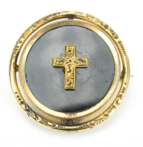 Antique 19th C Revolving Mourning Locket Brooch: Antique 19th C Revolving Mourning Locket Brooch. Gold filled with black onyx / basalt glass front panel set with a chased cross, back with locket. Measures just over 1.25 inches in diameter.