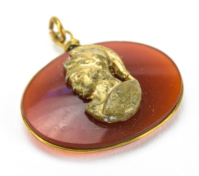 Antique 19th C Carnelian & Gilt Cameo Pendant Fob: Antique 19th C Carnelian & Gilt Cameo Pendant Fob. Having a gilt plaque of a Greco Roman soldier on the front. Measures 1 inch in width.