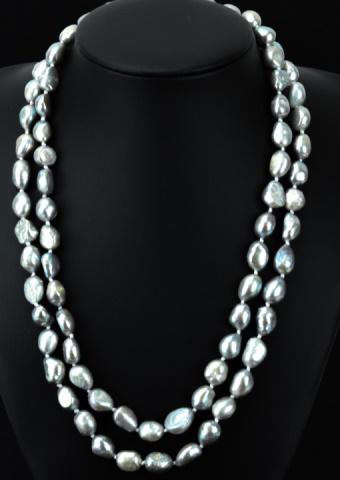 Pair of Silver Tone Baroque Pearl Necklace Strands: Pair of Silver Tone Baroque Pearl Necklace Strands. Hand knotted on silk thread. Each set with high luster iridescent silver tone baroque pearls measuring approximately 10 to 12 mm in length. Each nec
