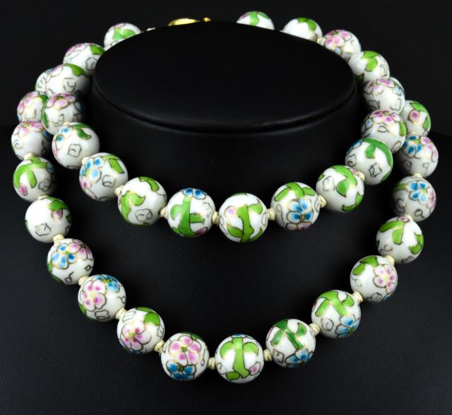 Estate Chinese Painted Porcelain Bead Necklace: Estate Chinese Painted Porcelain Bead Necklace. The beads are made to resemble cloisonne enamel. Hand knotted. Chinese gold plated filigree clasp. Measures 25 inches in length. Beads are approximately