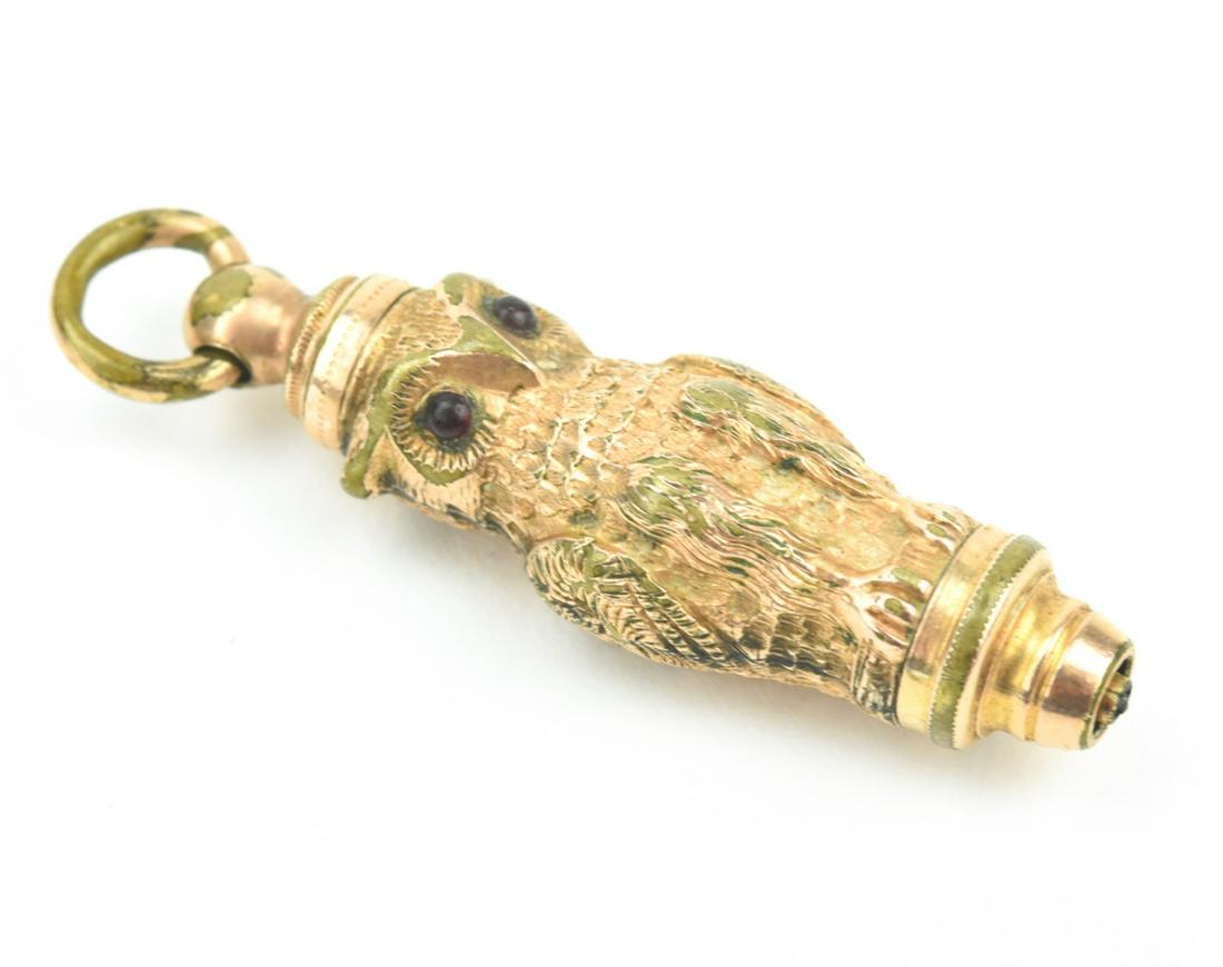 Antique 19th C Gold Figural Owl Pendant / Fob: Antique 19th C Gold Figural Owl Pendant / Fob That Holds a Pencil. Well detailed, modeled in gold filled with ruby paste eyes. Measures just over 1.5 inches in length.