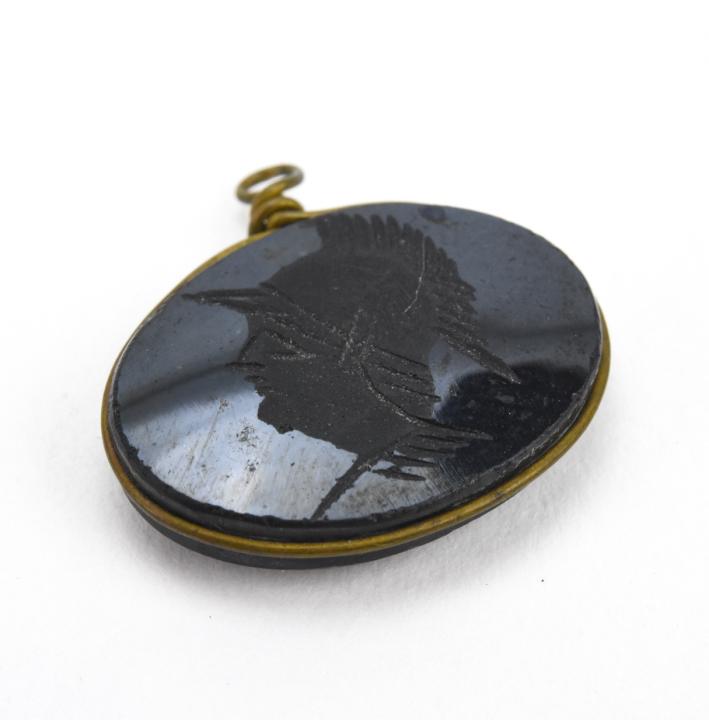 Antique Hand Carved Onyx Intaglio Pendant / Charm: Antique Hand Carved Onyx Intaglio Pendant / Charm. Greco Roman solider design. One of two in this auction. Measures .75 of an inch in width.
