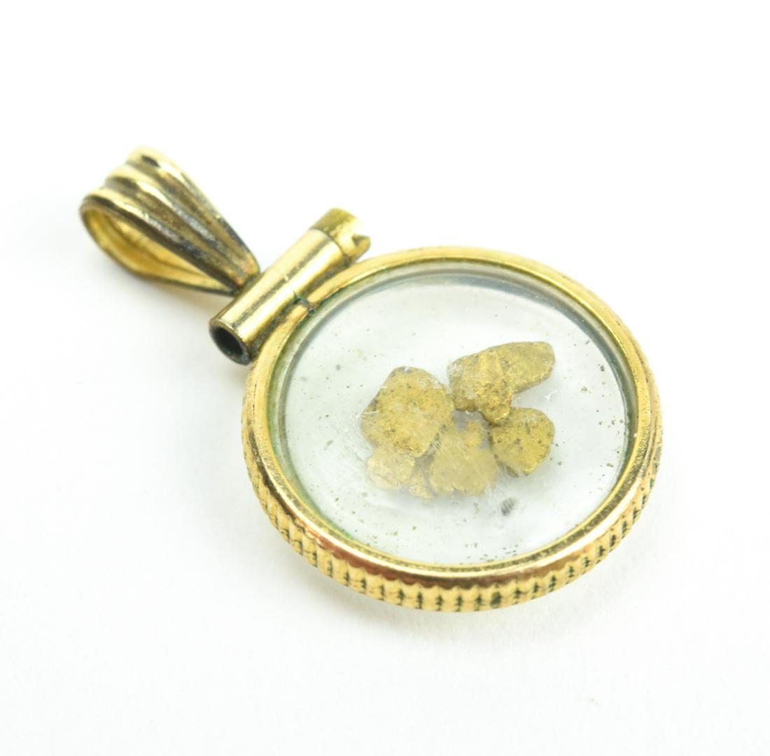 Estate Glass Front & Back Locket w Real Gold Flake: Estate Glass Front & Back Locket w Real Gold Flakes. Measures just under 1 inch in length.