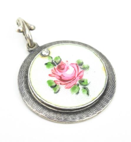 Antique Sterling Guilloche Enamel Madonna Pendant: Antique Sterling Guilloche Enamel Madonna Locket Necklace Pendant. Having an enamel scene of a rose on front panel. Hallmarked. Scene of Our Lady of Mount Carmel. Measures just under 1.5 inches in len