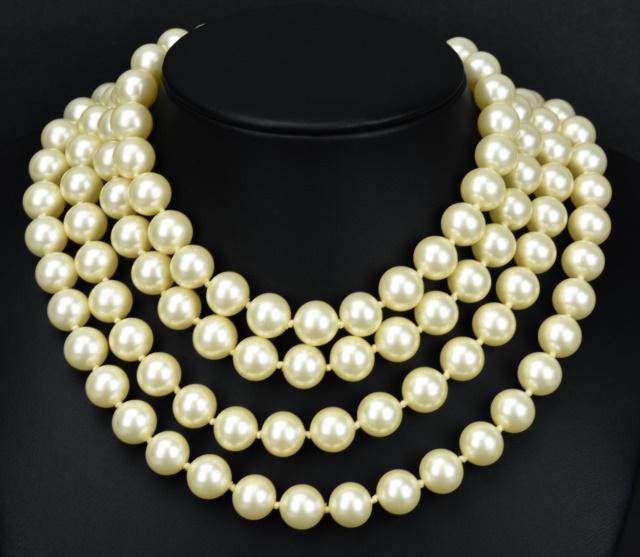 Vintage Costume Jewelry Trifari Pearl Necklace: Vintage Costume Jewelry Signed Crown Trifari Double Strand Faux Pearl Necklace. Measures 30 inches in length.