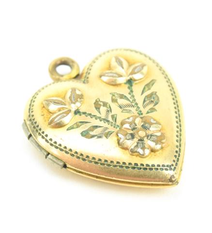 Estate WWII Era Heart Locket Necklace Pendant: Estate WWII Era Heart Locket Necklace Pendant. Sweat heart locket with floral motif. Gold filled. Measures 1 inch in length.