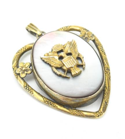Estate WWII Era Sweat Heart Military Locket: Estate WWII Era Sweat Heart Military Locket Necklace Pendant. Gold filled and mother of pearl. Measures 1.5 inches in length.
