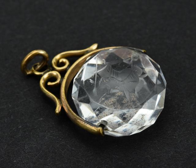 Antique 19th C Rock Crystal Intaglio Spinner Fob: Antique 19th C Rock Crystal Intaglio Spinner Fob or Necklace Pendant w Gold Filled Setting. Measures just over 1 inch in length.