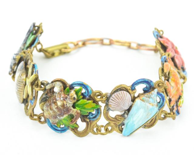 Vintage Gilt Metal Enamel Sea Life Panel Bracelet: Costume Jewelry Vintage Gilt Metal Enamel Sea Life Panel Bracelet. Measures 7.75 inches in length.